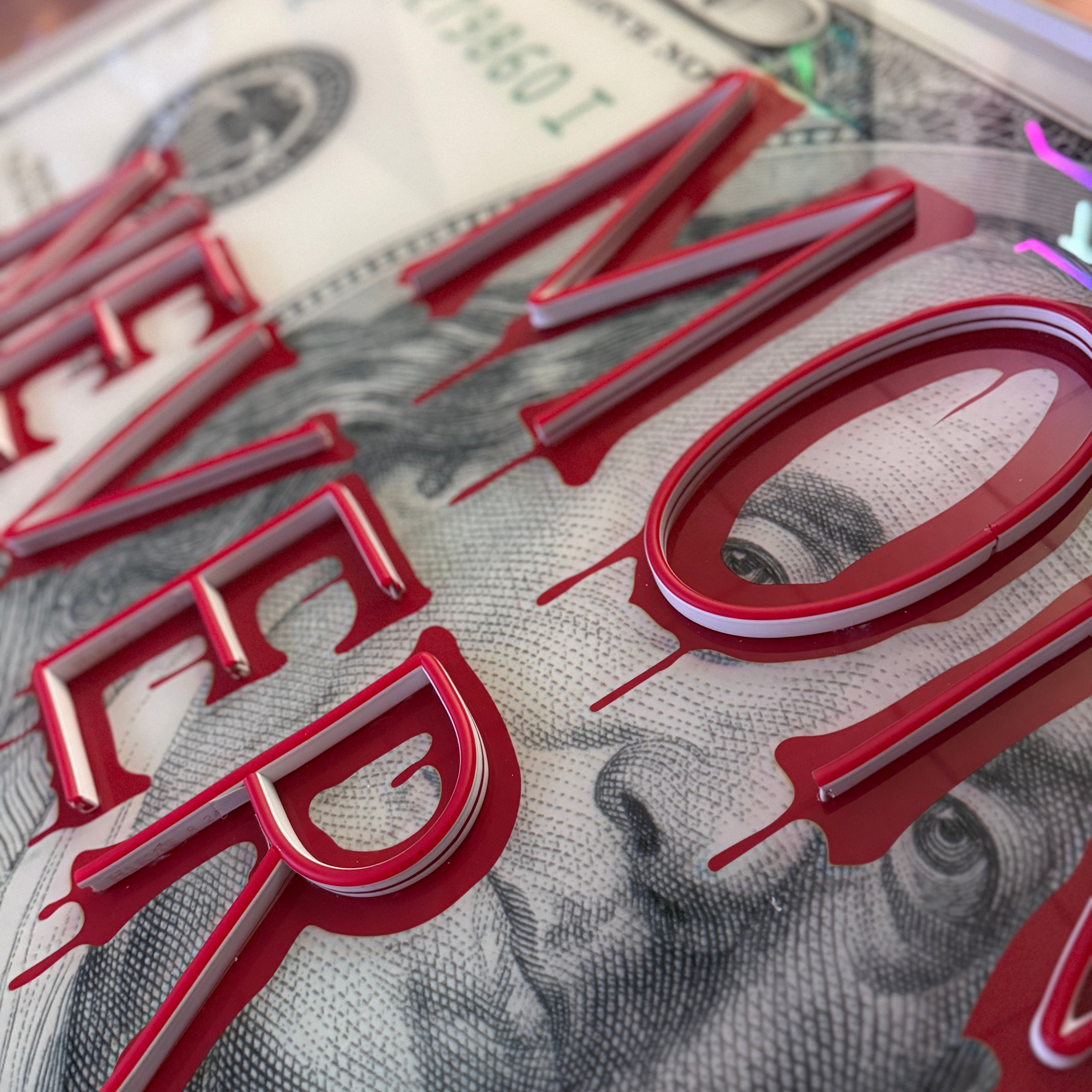 Red letters spelling 'NEVER' on a dollar bill background